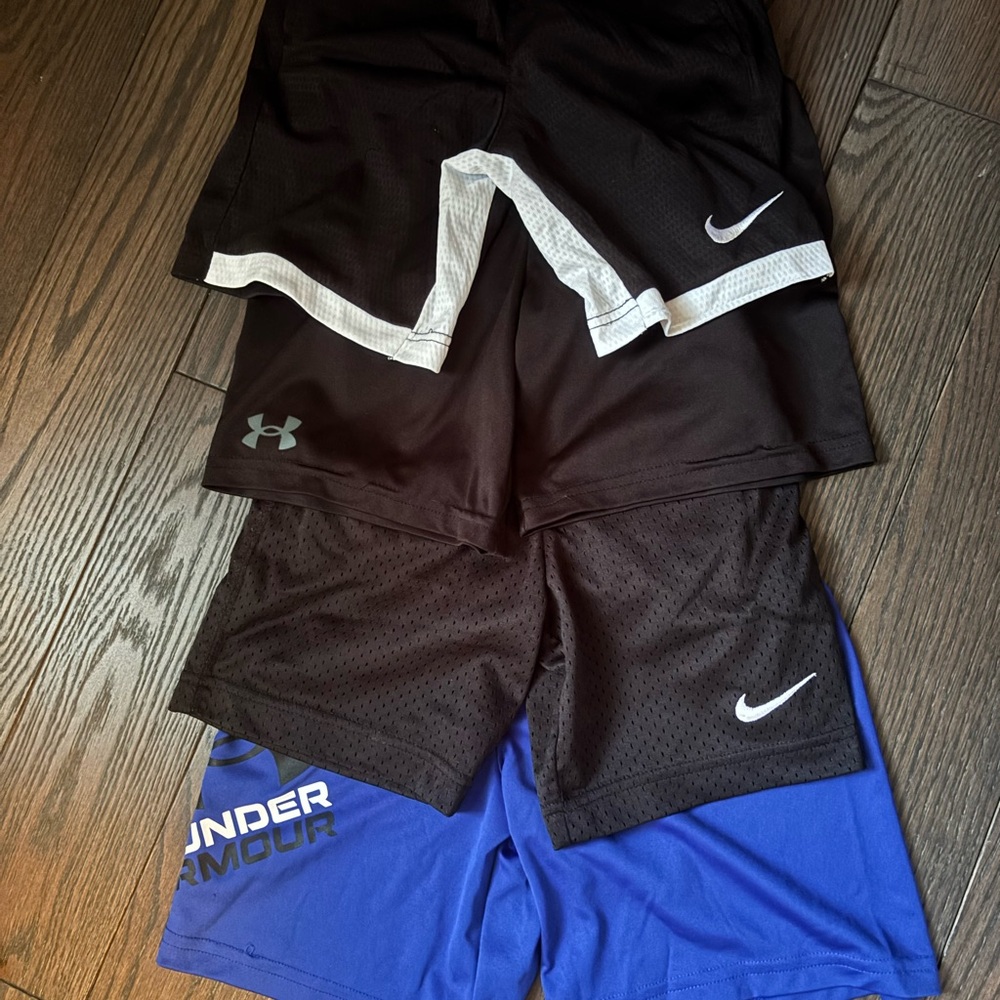 4 Pairs of Nike and Under Armour Kids Shorts